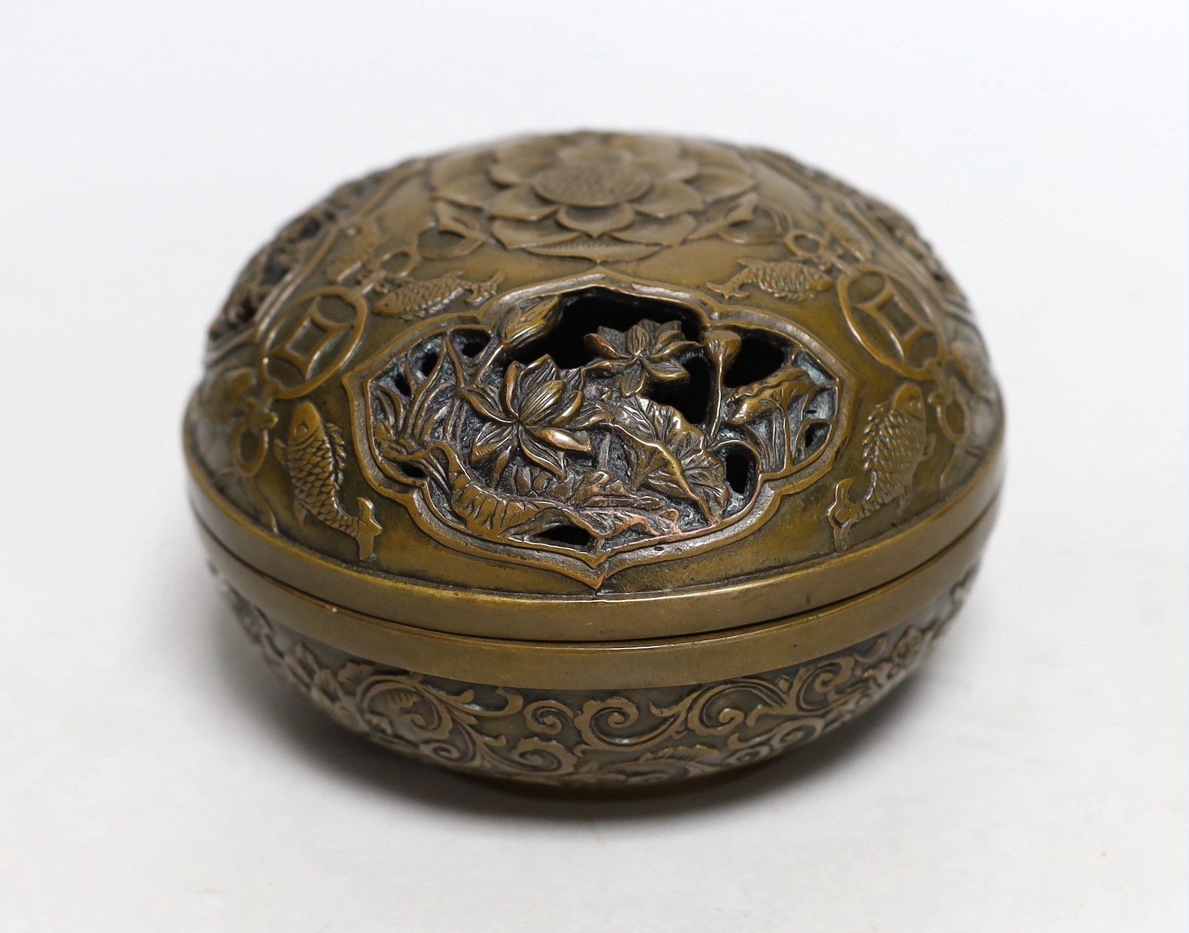 A Chinese circular carved bronze censer, 13.5cm diameter